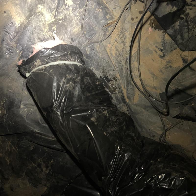 Black insulated duct wrapped with tape in dirt floor crawlspace Black insulated duct wrapped with tape in dirt floor crawlspace