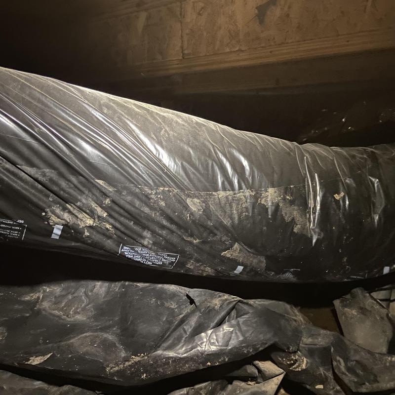 Flexible ductwork with dirt and damage in crawl space Flexible ductwork with dirt and damage in crawl space