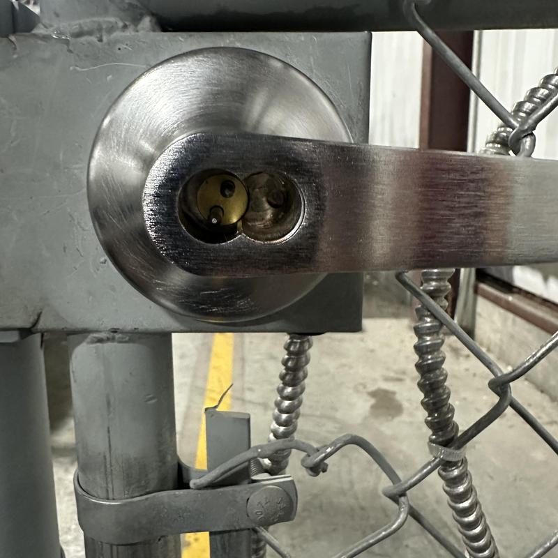 Interchangeable core cylinder on metal gate lock handle