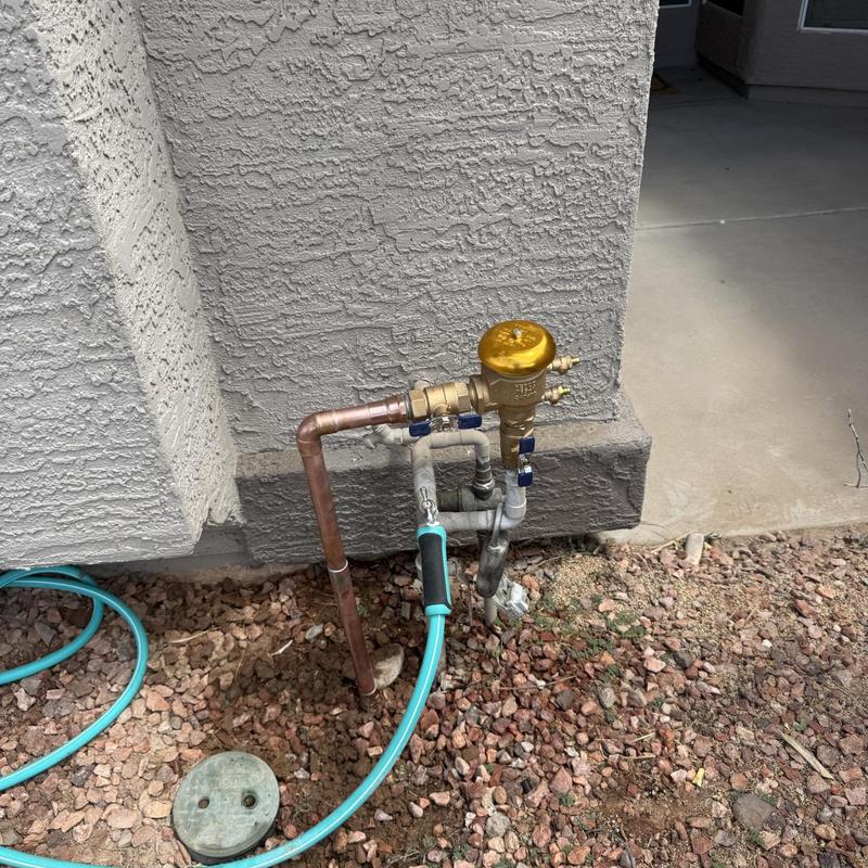 1 inch pressure vacuum breaker with copper piping outdoors