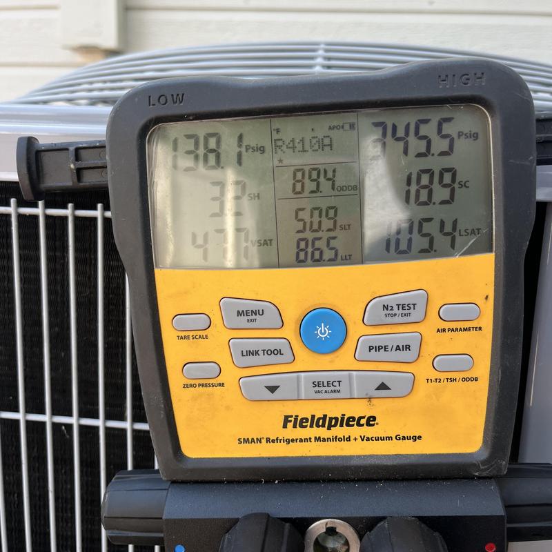 Refrigerant manifold gauge measuring AC system pressure Refrigerant manifold gauge measuring AC system pressure