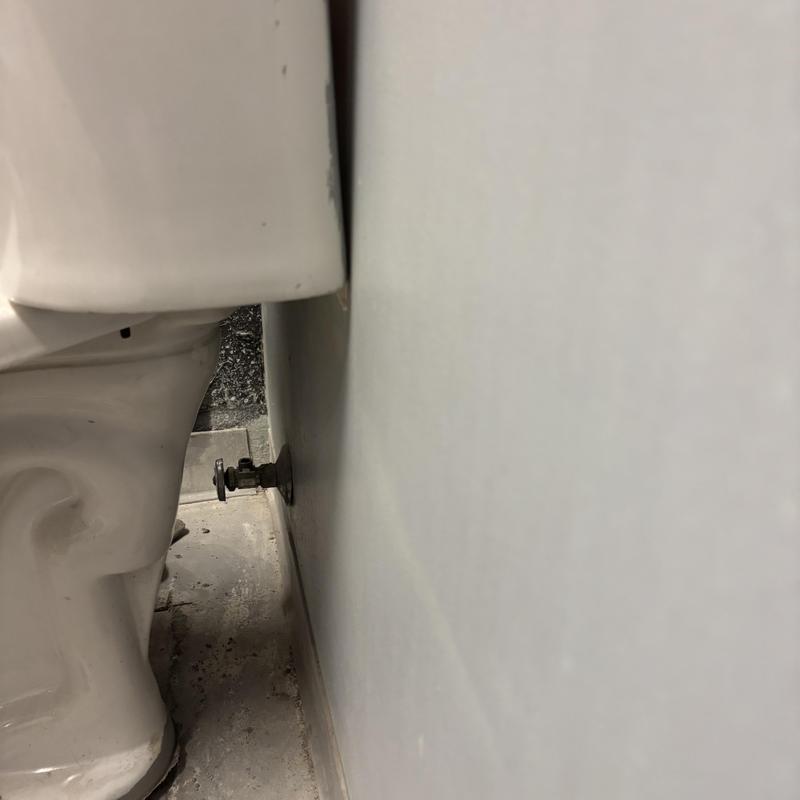 Toilet installation with flush valve and wall mount connection Toilet installation with flush valve and wall mount connection