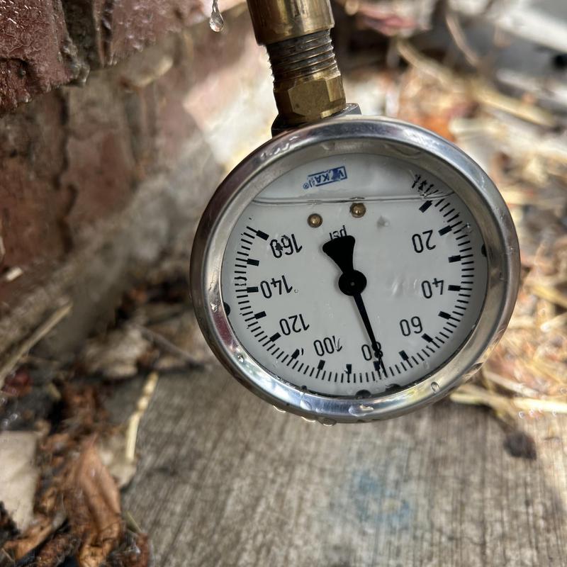 Pressure gauge on expansion tank showing pressure reading Pressure gauge on expansion tank showing pressure reading