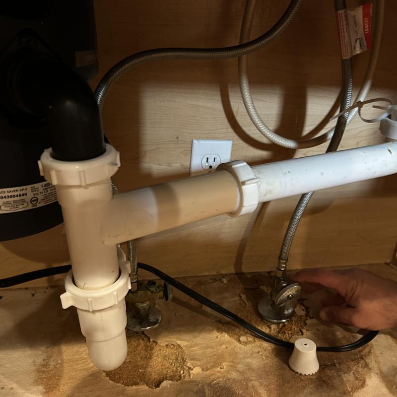 Under-sink PVC drain pipes with water shutoff valve Under-sink PVC drain pipes with water shutoff valve
