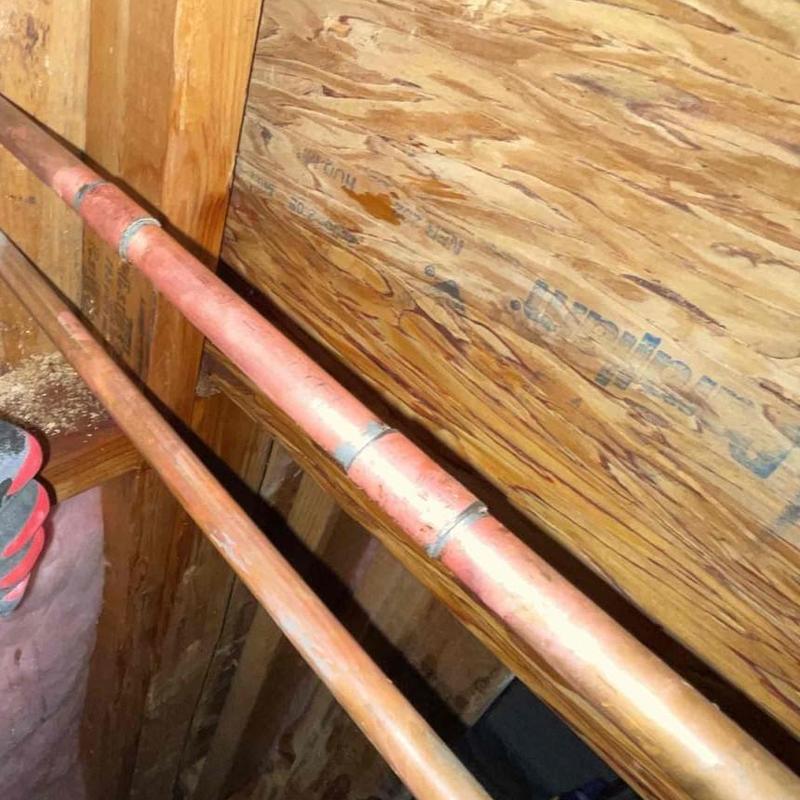 Copper water piping with soldered joints in attic space