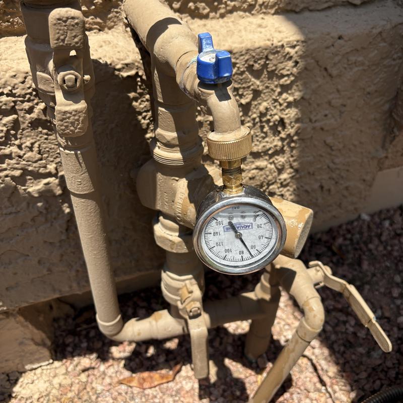 Water pressure gauge on outdoor irrigation system