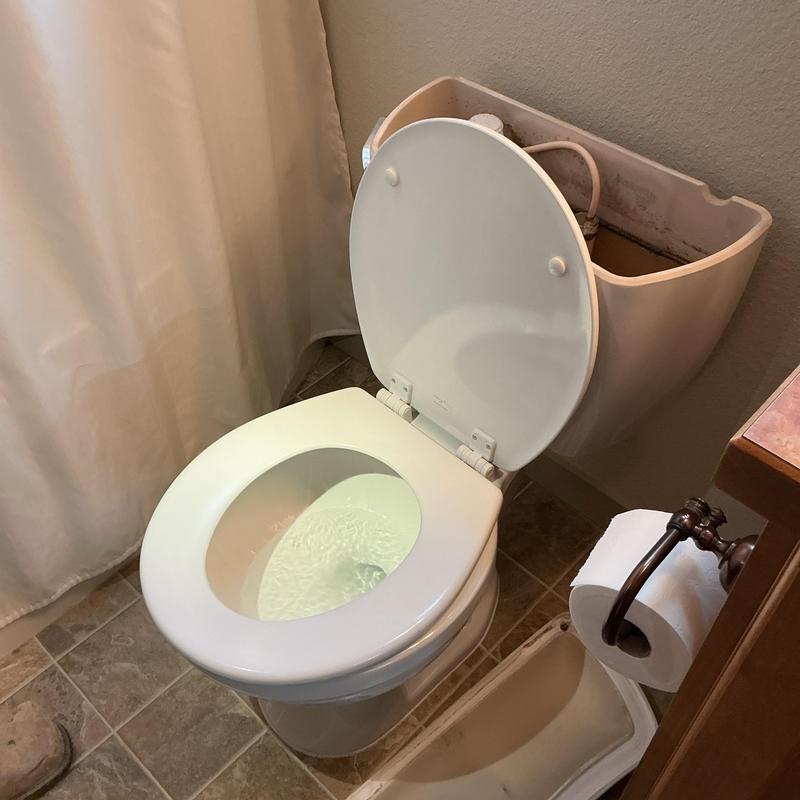 Toilet tank and bowl replacement in residential bathroom Toilet tank and bowl replacement in residential bathroom