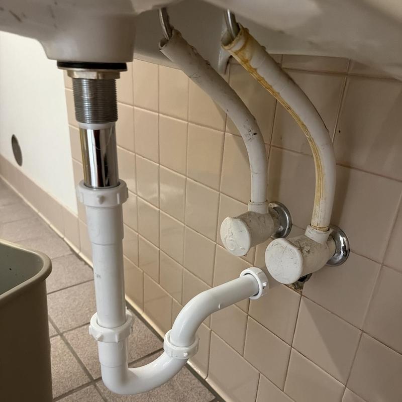 P-trap and extension pieces under kitchen sink P-trap and extension pieces under kitchen sink