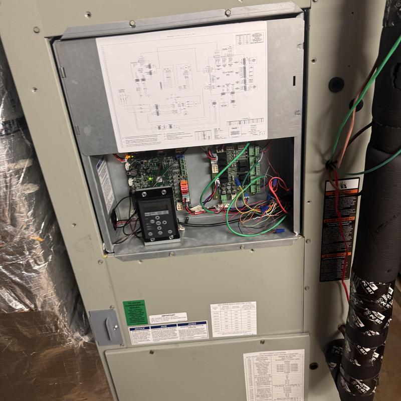 Heat pump control board with wiring in HVAC unit