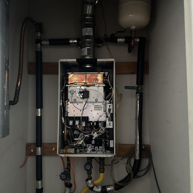 Rinnai tankless water heater with plumbing and wiring