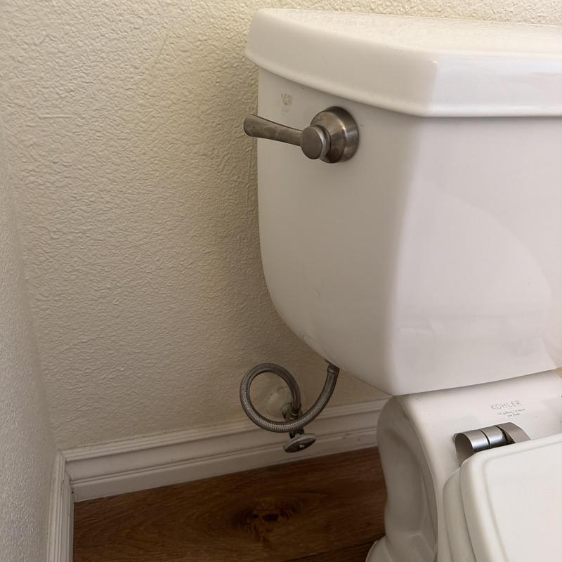 Toilet tank with new wax ring and bolts installed Toilet tank with new wax ring and bolts installed