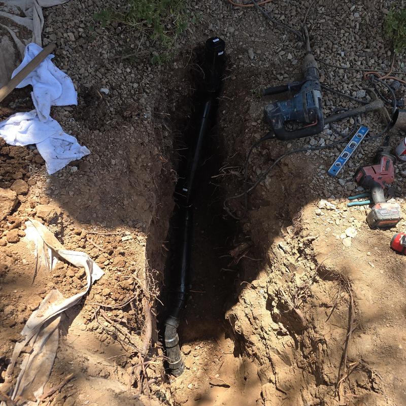ABS sewer main line replacement trench with tools