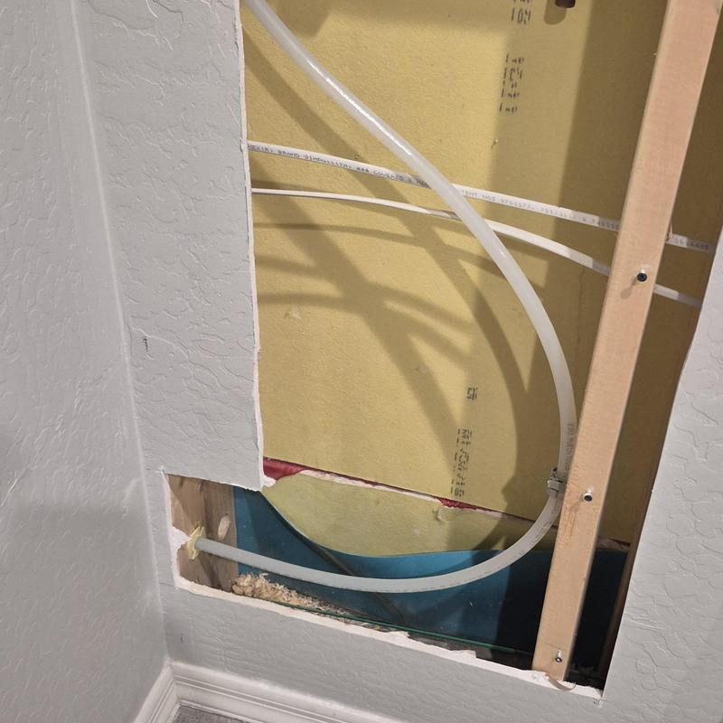 Sink water supply lines in closet wall cavity