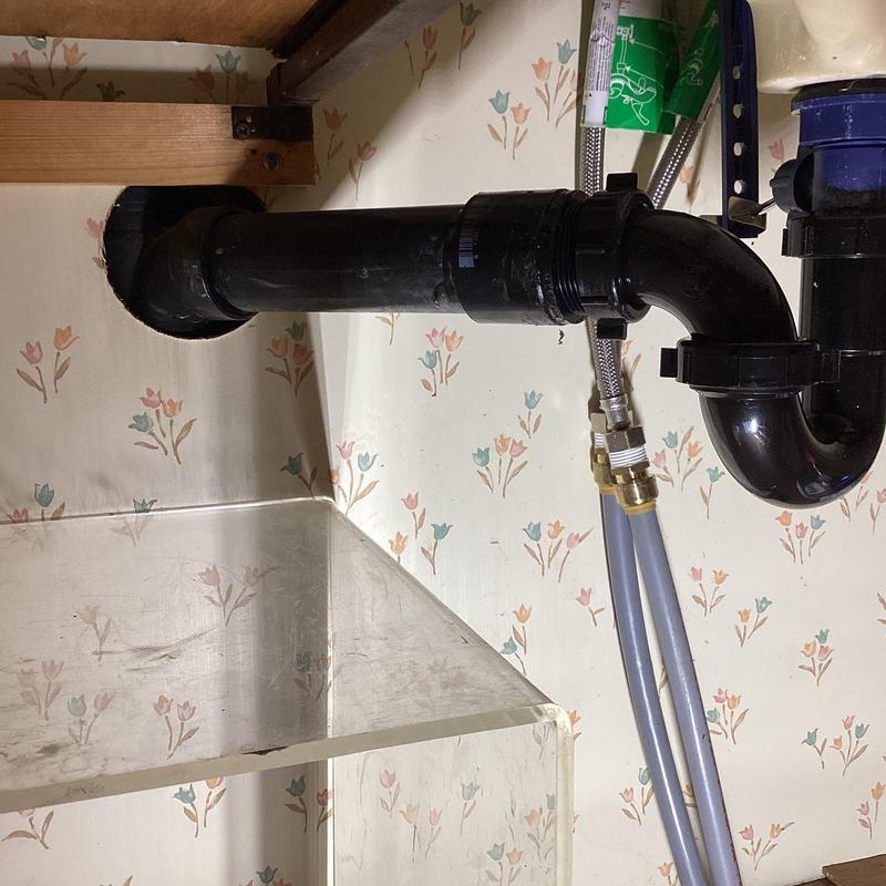 P-trap assembly under kitchen sink with new fittings