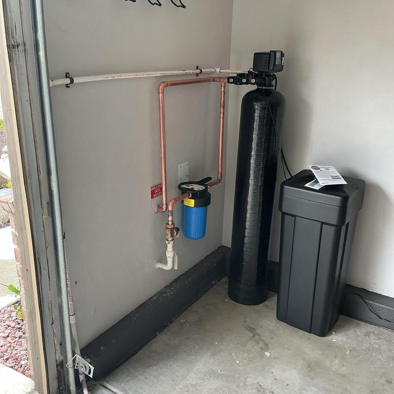 Water softener system with pressure valve installation