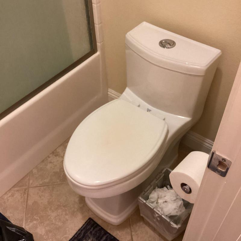 American Standard toilet replacement in bathroom corner