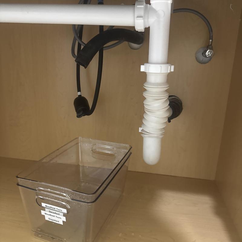 AC condensation line reattachment under sink in commercial building