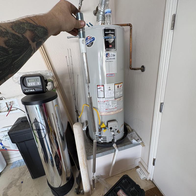 Water heater anode rod removal and inspection