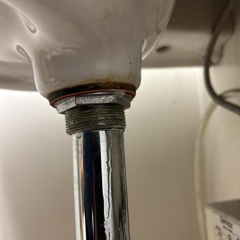 Commercial drain pipe leak under sink with gasket seal