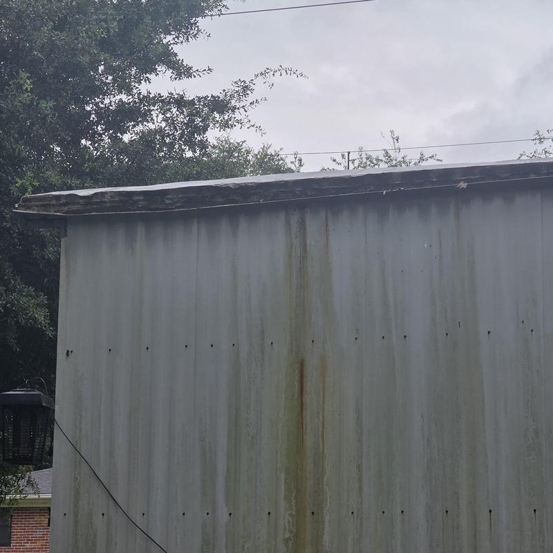Mobile home roof with water damage and rust stains