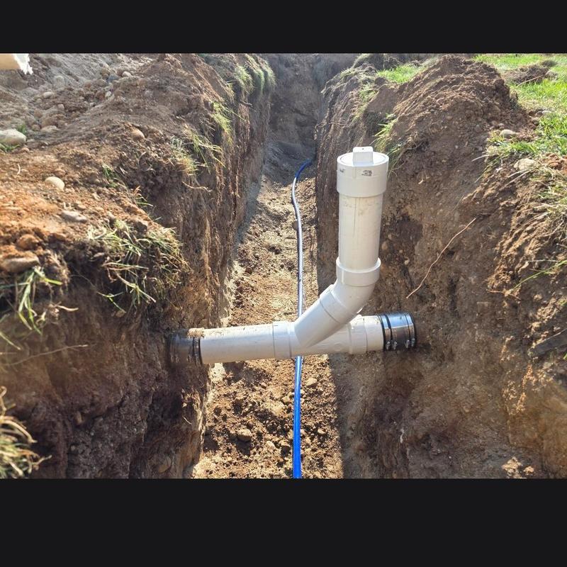 Water service pipe installation in trench excavation