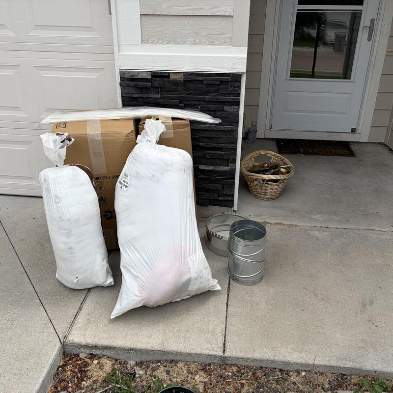 Ductwork and insulation replacement materials on driveway Ductwork and insulation replacement materials on driveway