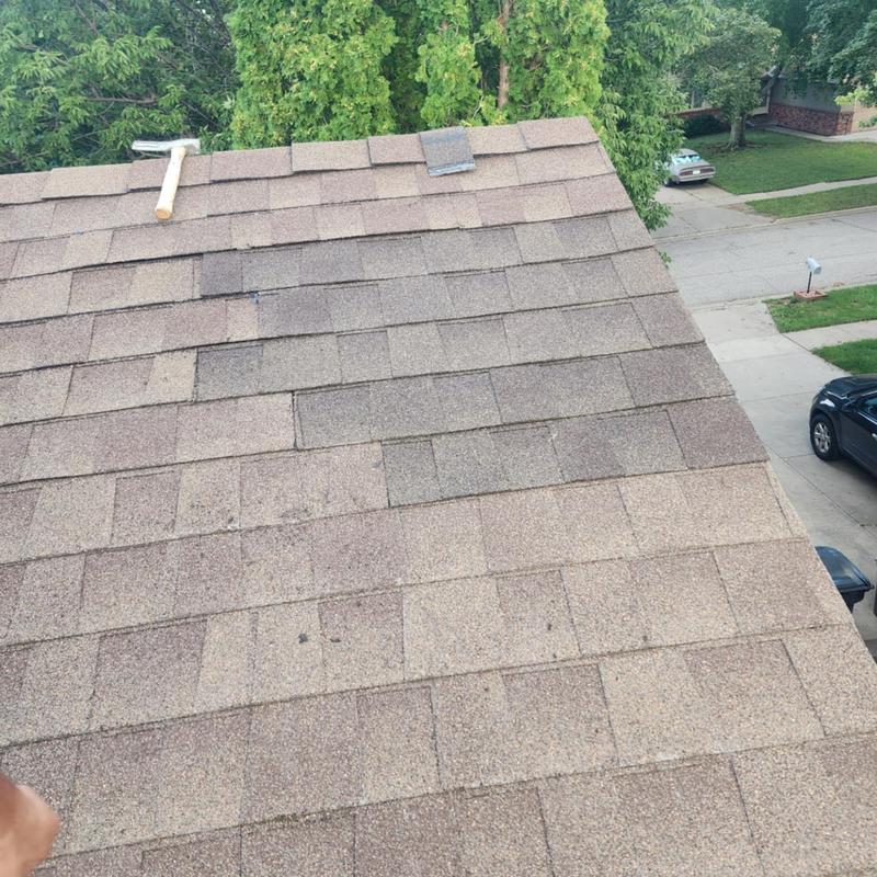 Laminated architectural shingles on residential roof Laminated architectural shingles on residential roof