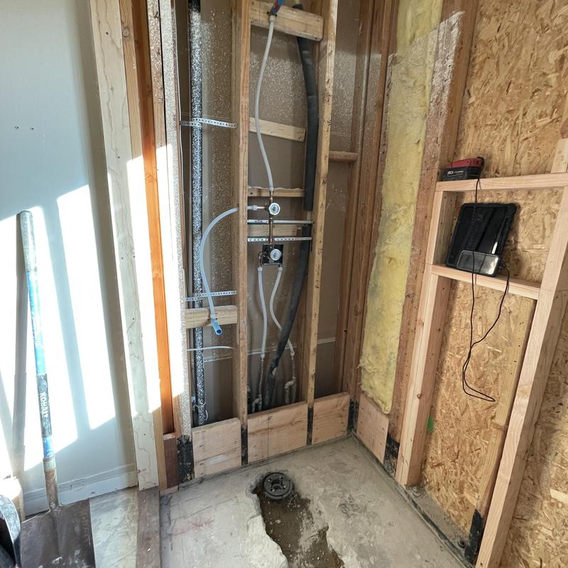 Wall-mounted bathtub faucet plumbing rough-in and reroute