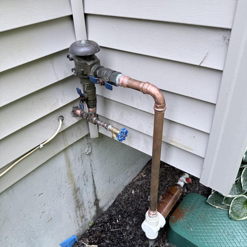 Irrigation main piping with valves and fittings outdoors