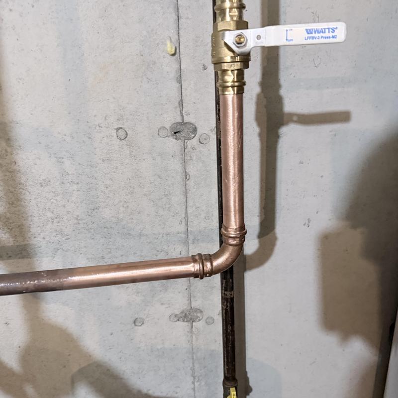 Copper irrigation main pipe with shutoff valve installed