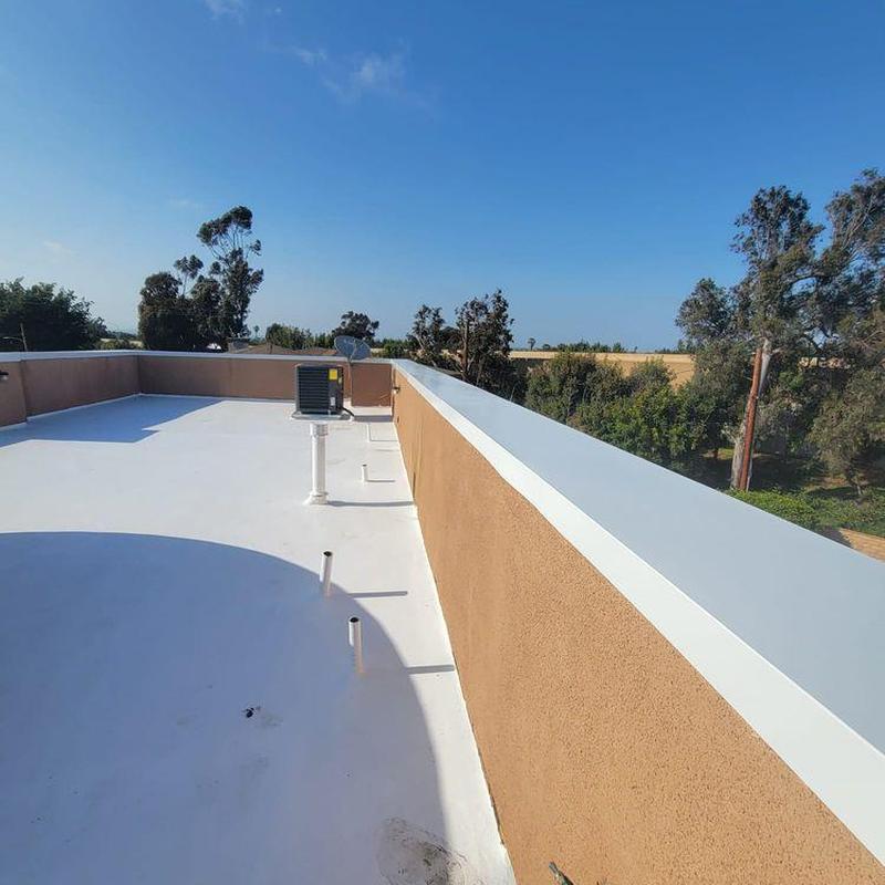 Flat roof with HVAC unit and safety railing Flat roof with HVAC unit and safety railing