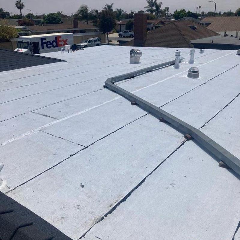 Flat roof surface with ventilation pipes and conduit Flat roof surface with ventilation pipes and conduit