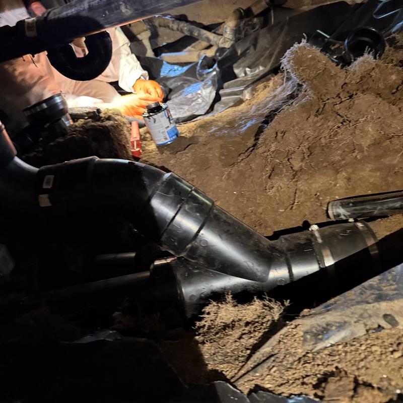 ABS waste piping installation in crawl space with vent tie-in ABS waste piping installation in crawl space with vent tie-in