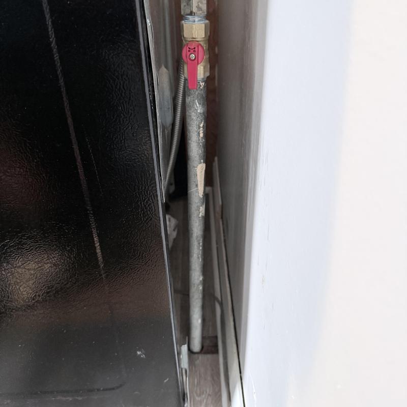 Gas valve and flex line installation behind range