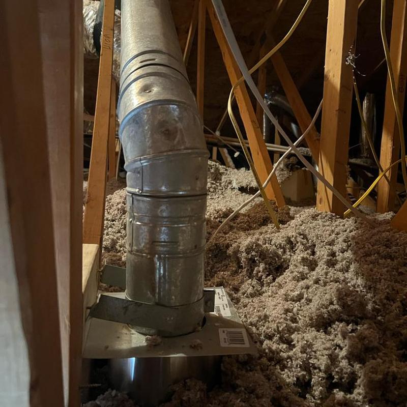 Water heater vent with insulation shield in attic Water heater vent with insulation shield in attic