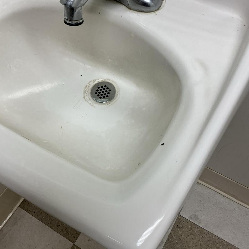 Sink drain grid and basin with faucet above