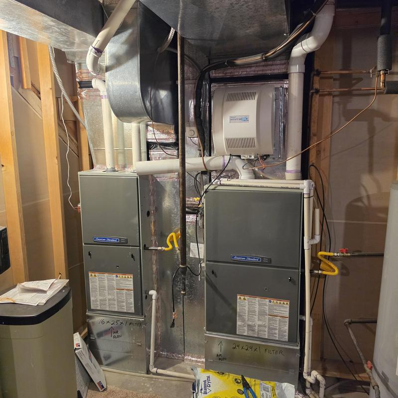 American Standard furnace units with ductwork and piping