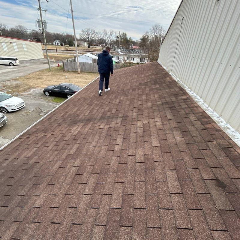 Asphalt shingle roof inspection showing hail damage