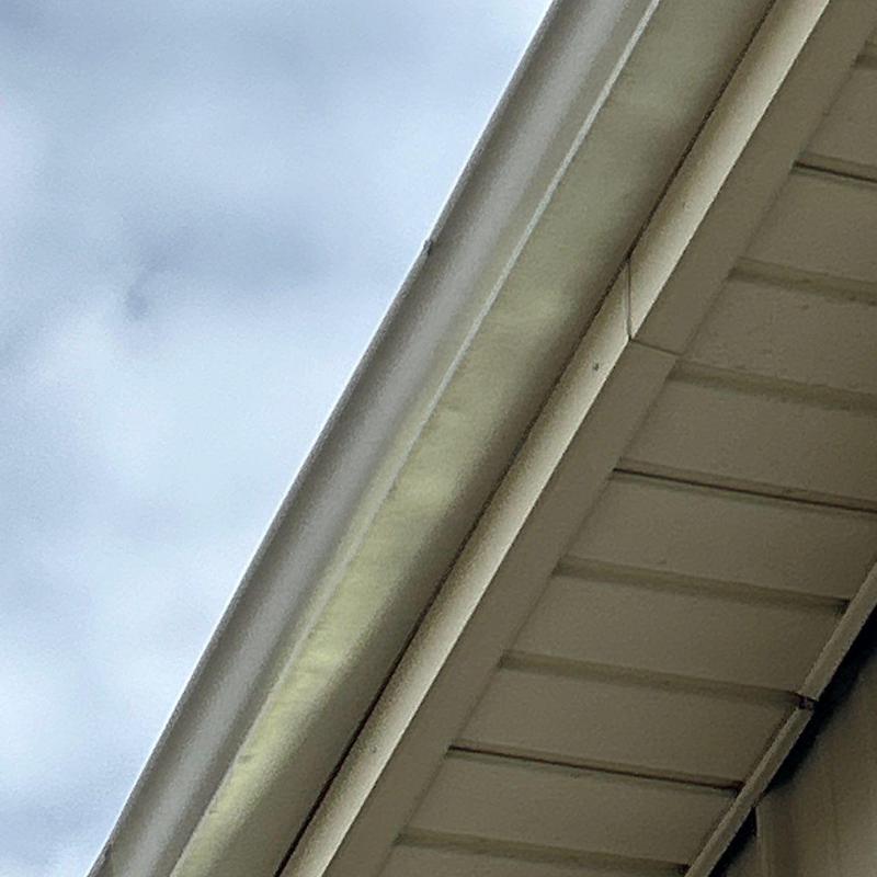 Gutter and soffit installation with seam detail