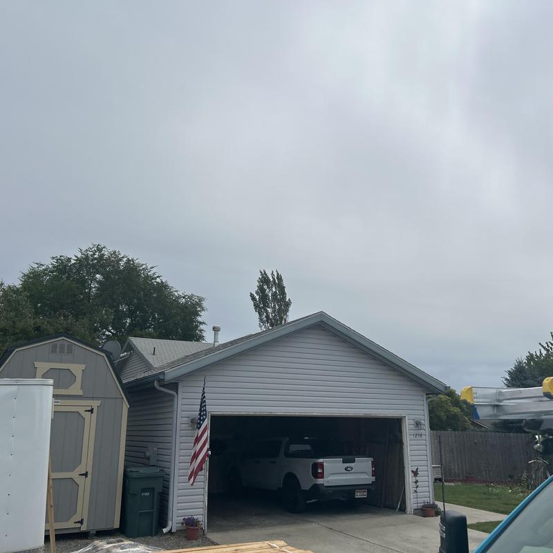 Asphalt shingle roof inspection on residential garage Asphalt shingle roof inspection on residential garage