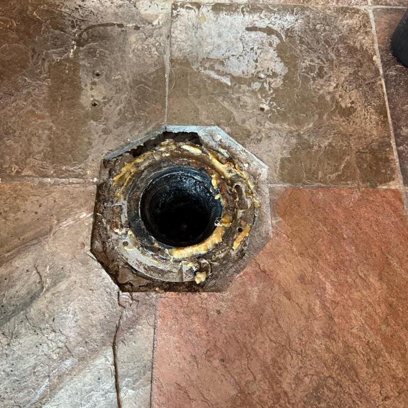Toilet flange on tiled floor without toilet installed Toilet flange on tiled floor without toilet installed