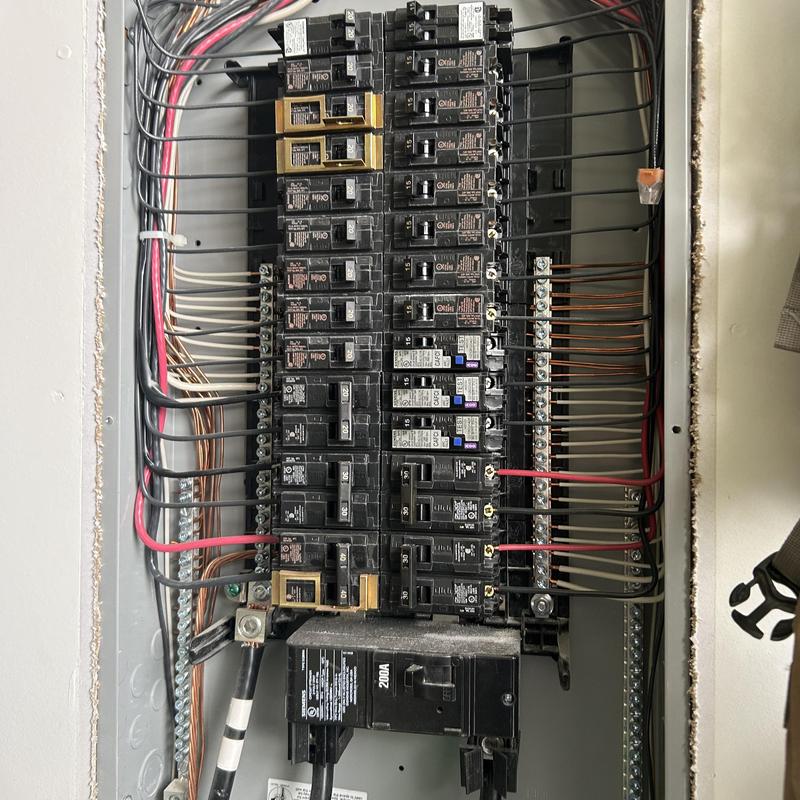Electrical panel with circuit breakers and wiring connections