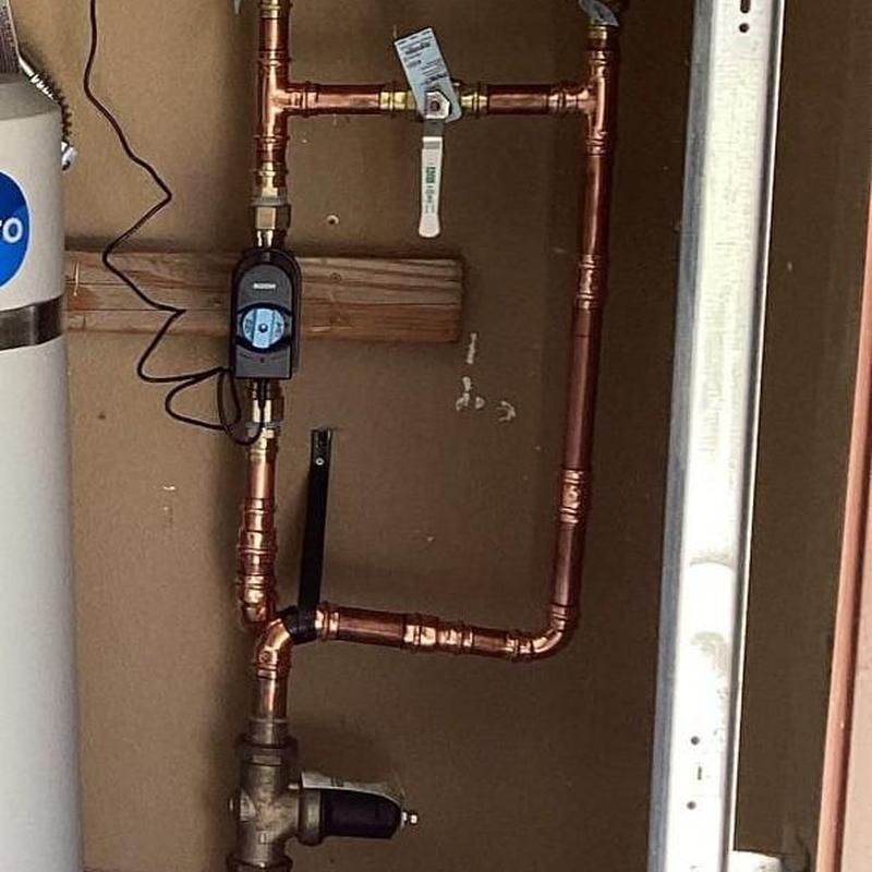Moen Flo Smart Water Monitor on copper piping