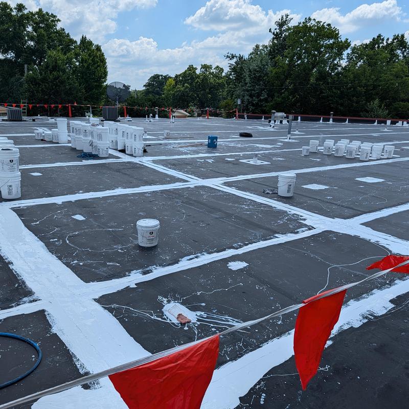 Flat EPDM roof seam sealing with white coating