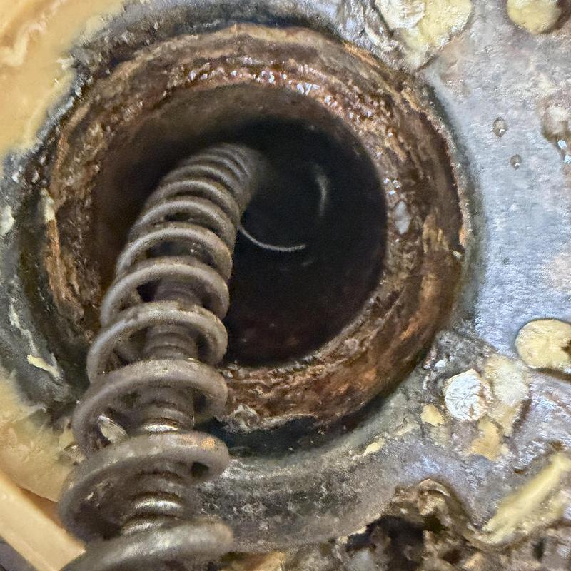 Main line plumbing cleanout with drain auger tool Main line plumbing cleanout with drain auger tool