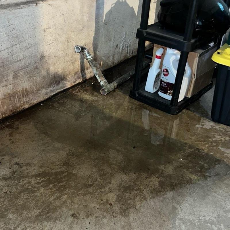 Leaking basement drain pipe with water pooling Leaking basement drain pipe with water pooling