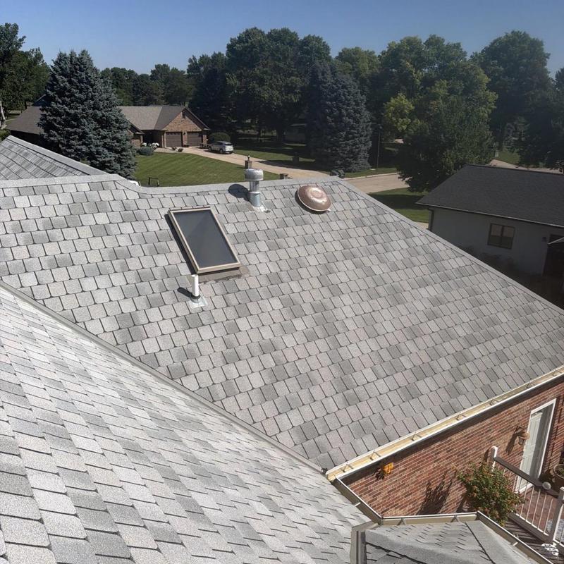 Roof shingles hail damage inspection on residential home Roof shingles hail damage inspection on residential home
