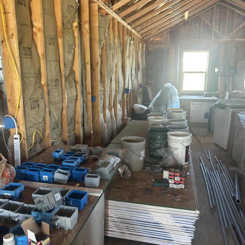 Electrical circuitry boxes and conduit in attic wall framing Electrical circuitry boxes and conduit in attic wall framing