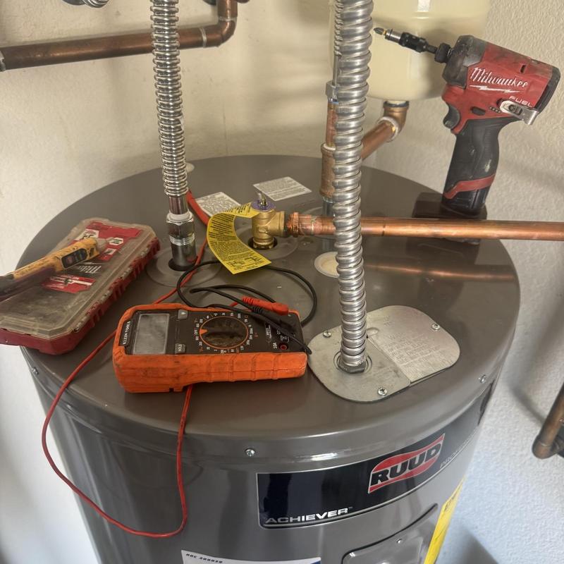 Water heater top with diagnostic tools and drill