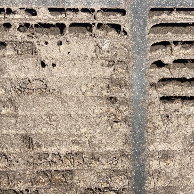 Condenser coil clogged with dirt and debris